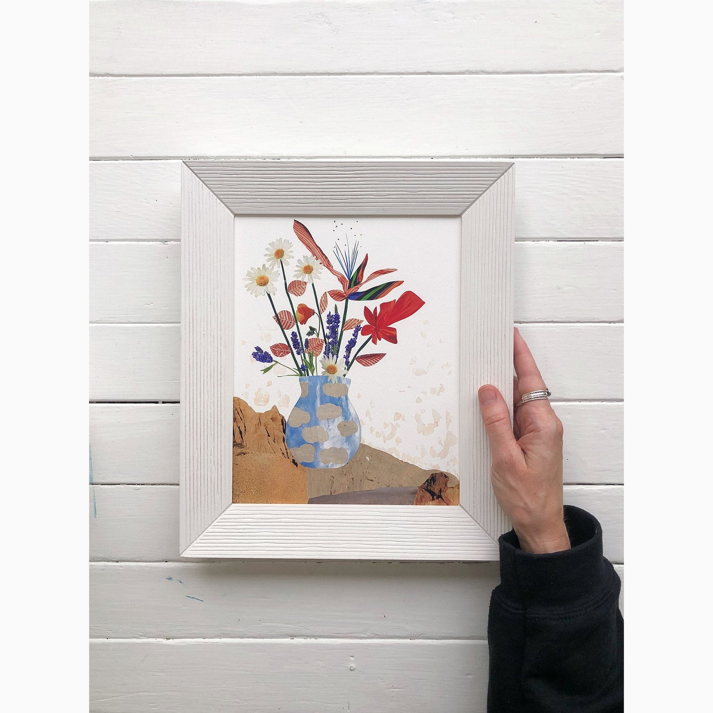 8 by 10 inch framed art print of everlasting summer collage shown in a frame held by one hand