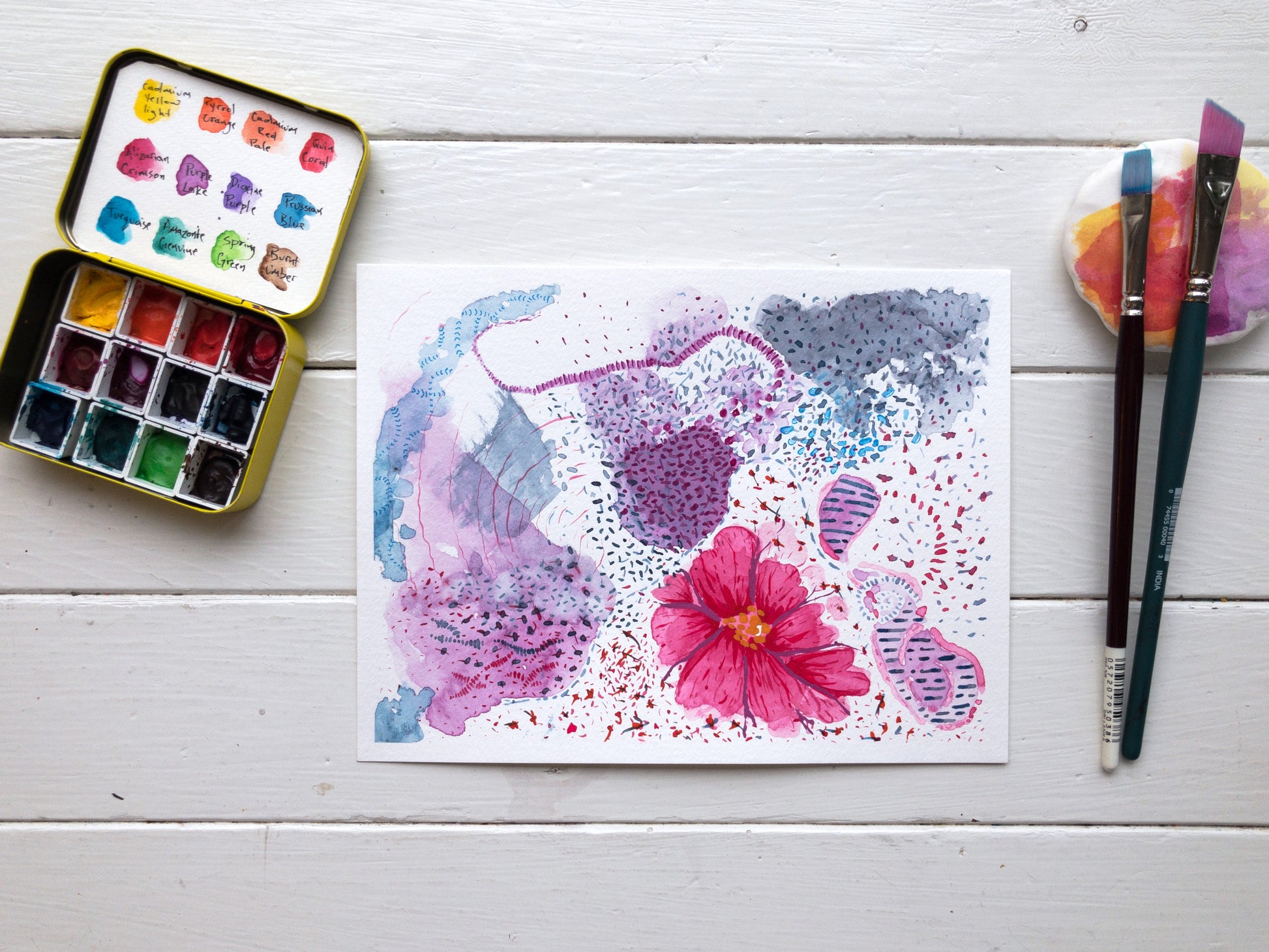 floral infinite watercolour painting in studio with paint brushes