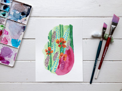 floral immortal watercolour painting on studio desk with paint brushes