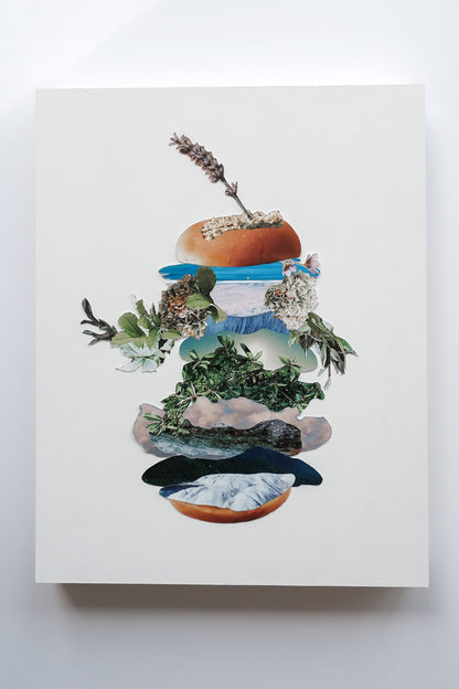 Original analog collage art of a tall "botanical burger" layered  images of plants, ocean, sky, clouds and flowers. A spear of lavender sticks out of the top bun.