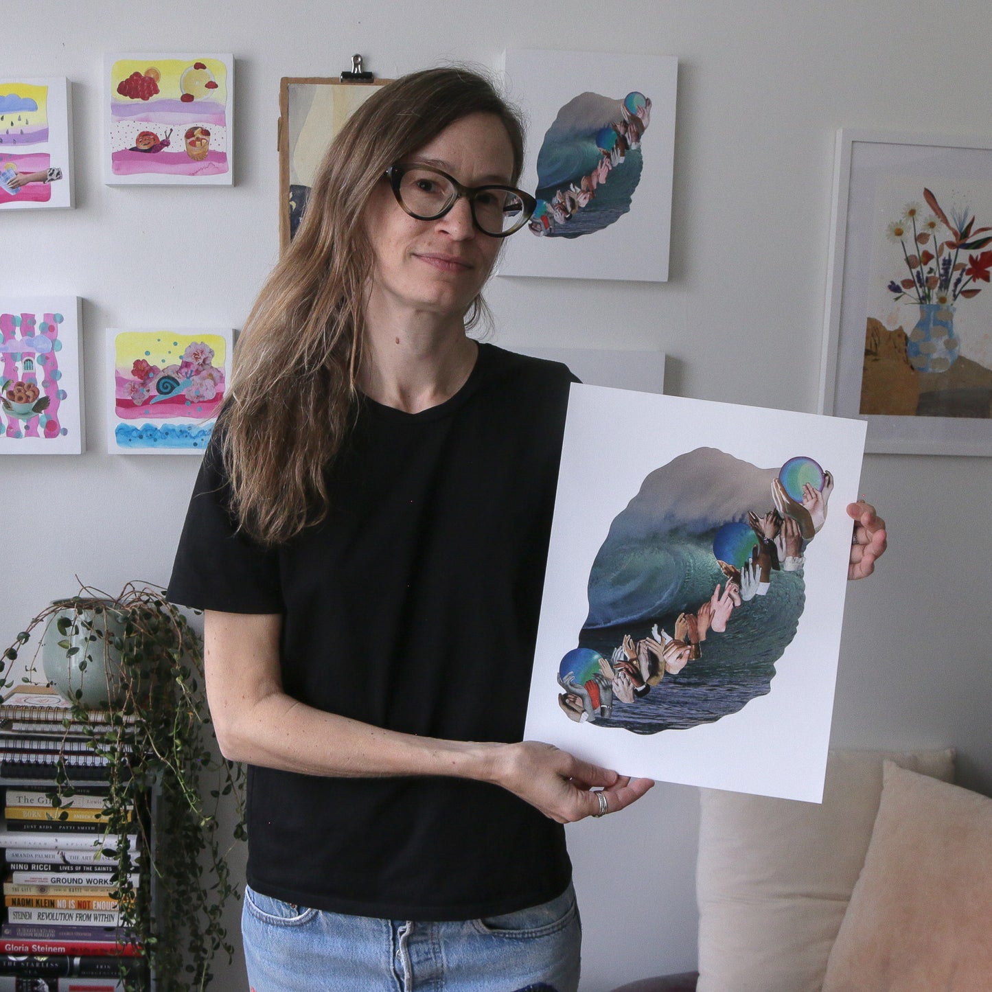 artist Marissa Schiesser three waves holding art print 